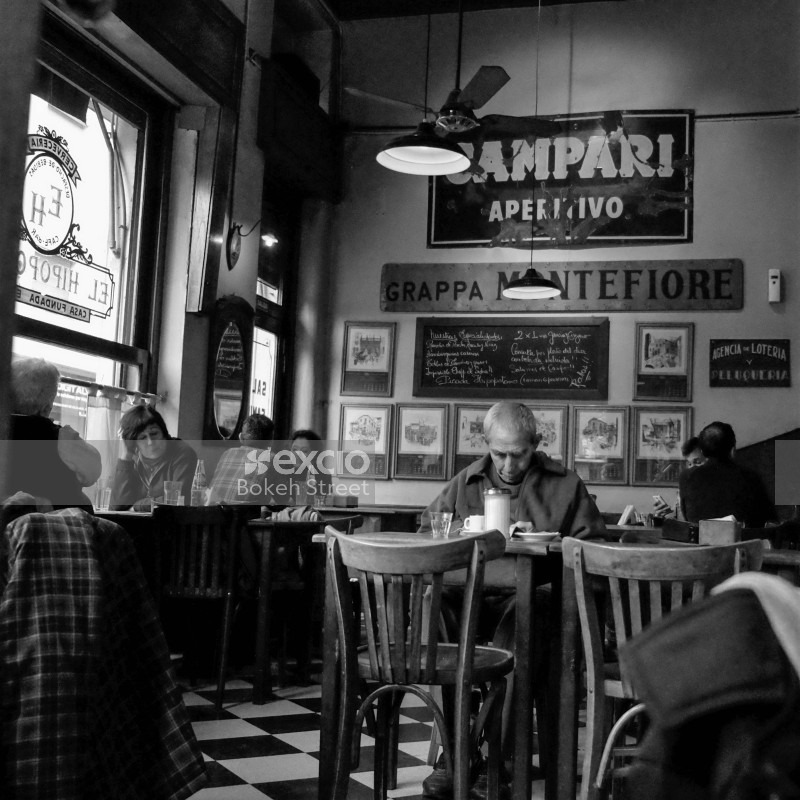 People sitting in a cafe black and white