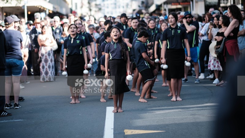 Maori children performing their traditional dance in the street at Cuba Dupa 2021 bokeh