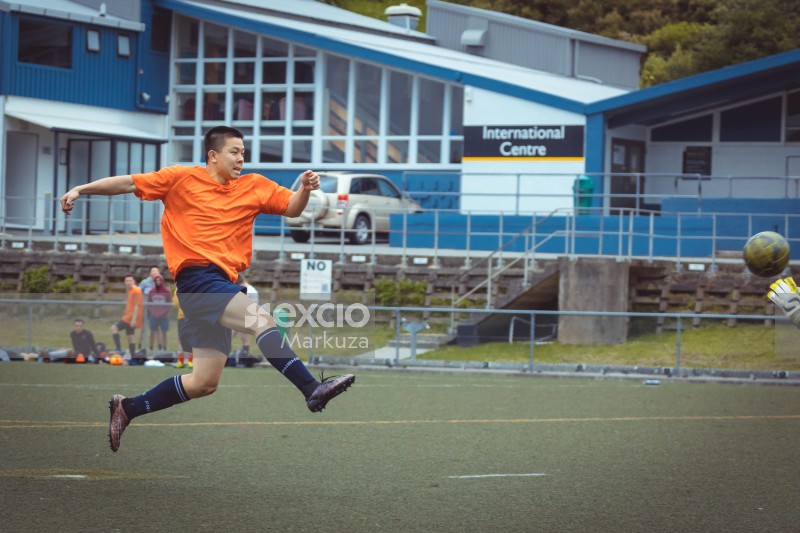 Player leaping in the air after kick - Sports Zone sunday league