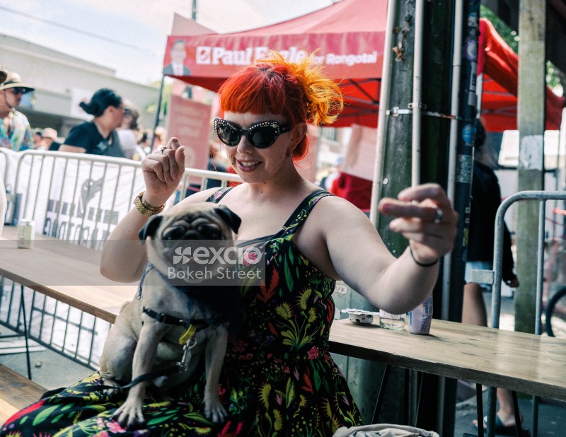 Woman with dog at festival