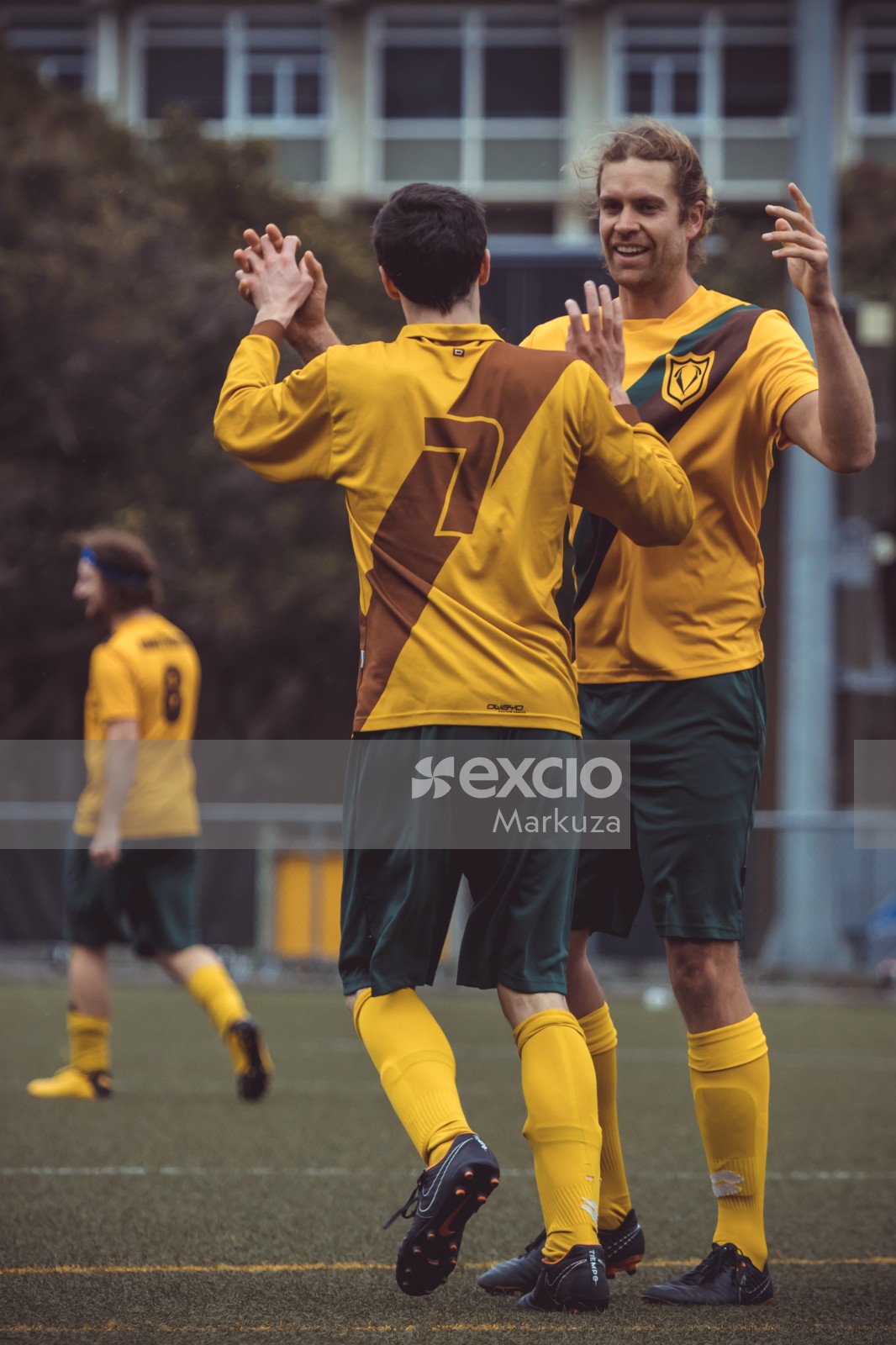 Two teammates celebrating after success - Sports Zone sunday league