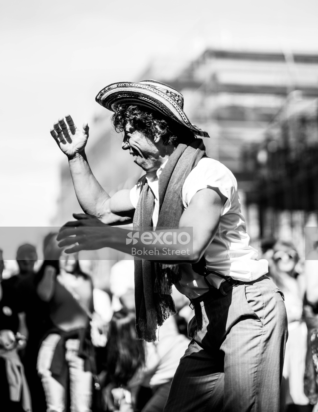 Man with a hat dancing in the street at Cuba Dupa 2021 bokeh monochrome
