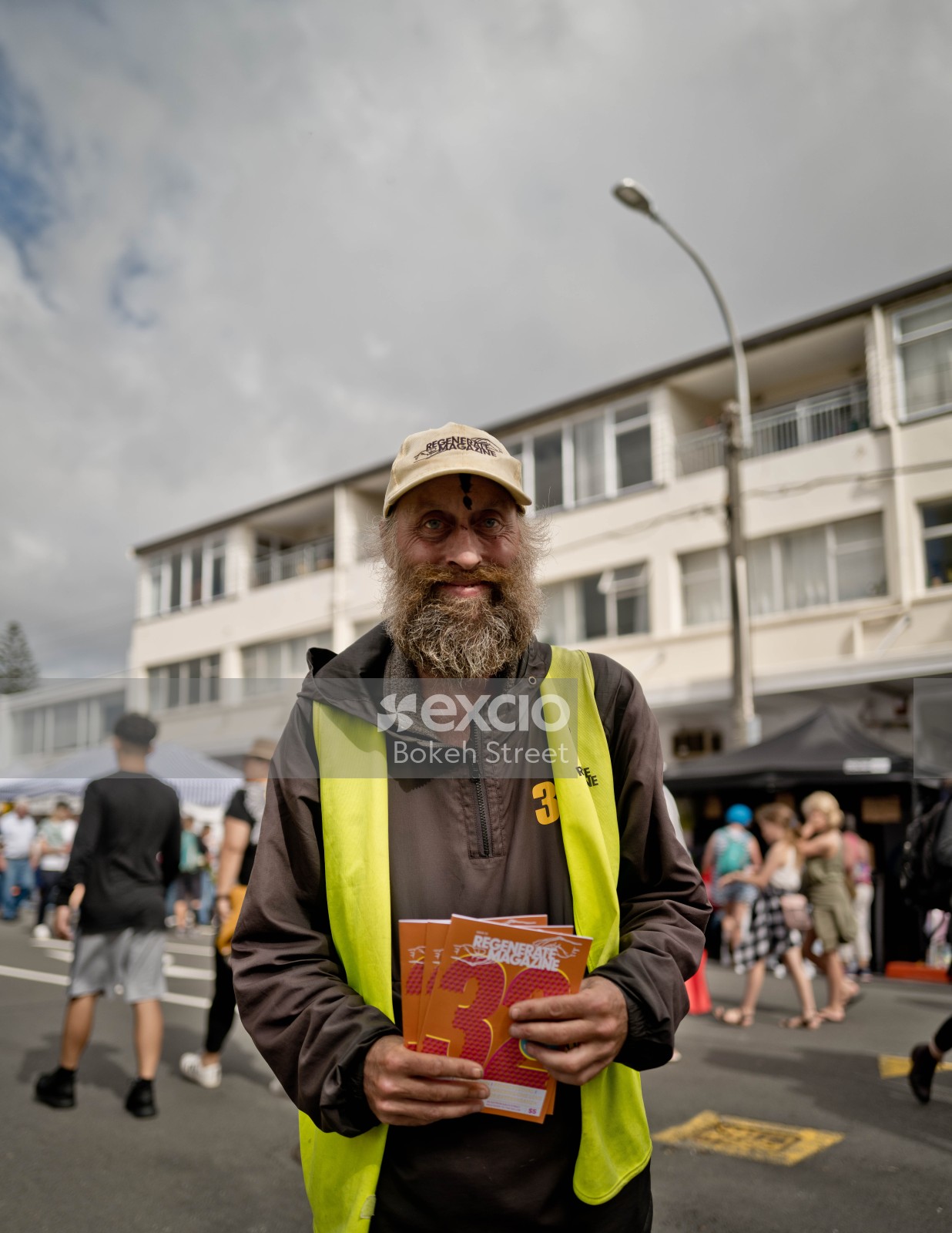 Old bearded guy holding Regenerate magazine at Newtown festival 2021