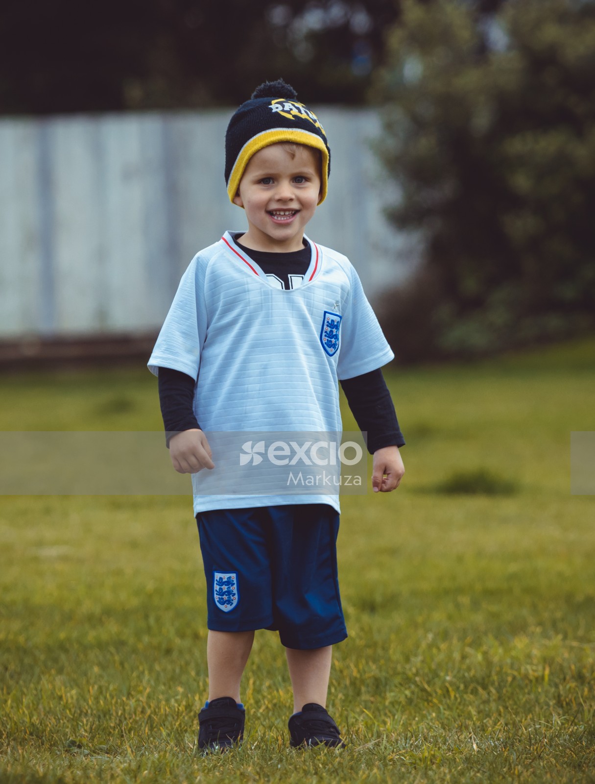 Little boy wearing England team kit at Little Dribblers football match
