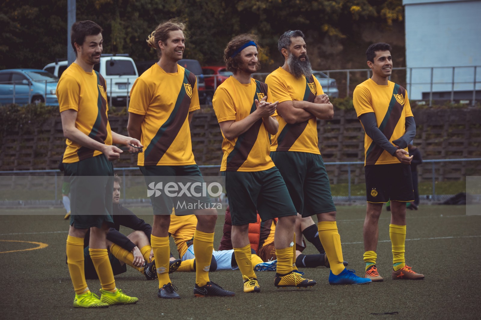 Football players in yellow shirts standing in a queue - Sports Zone sunday league