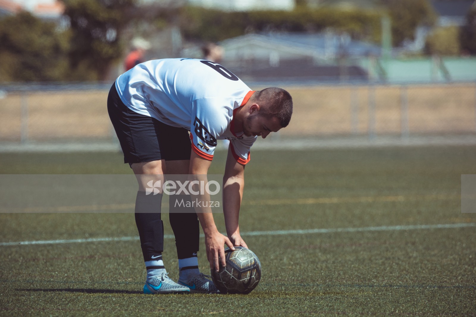 Player setting football on the ground - Sports Zone sunday league
