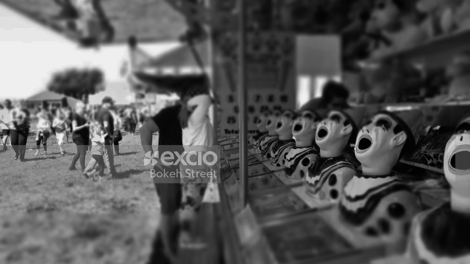 Target game at a carnival at Waitangi park, Wellington black and white