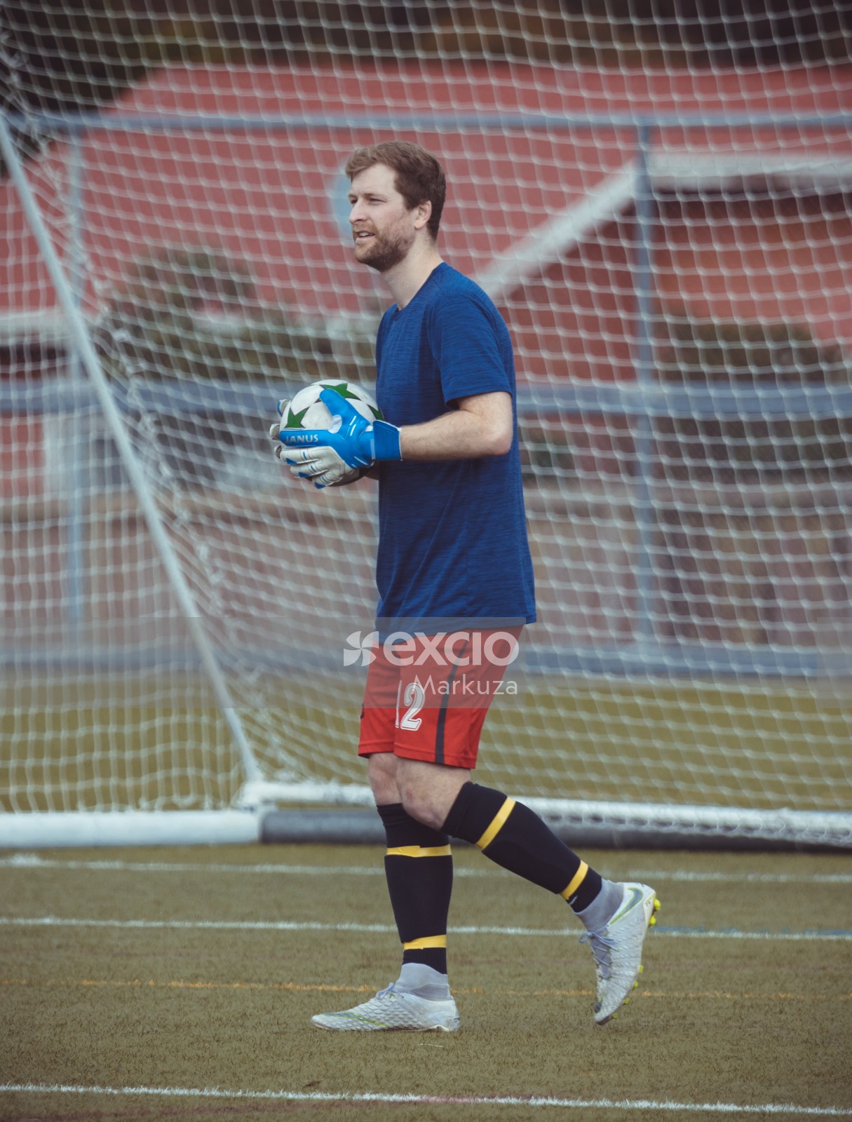Goalkeeper holding a ball in his hands - Sports Zone sunday league