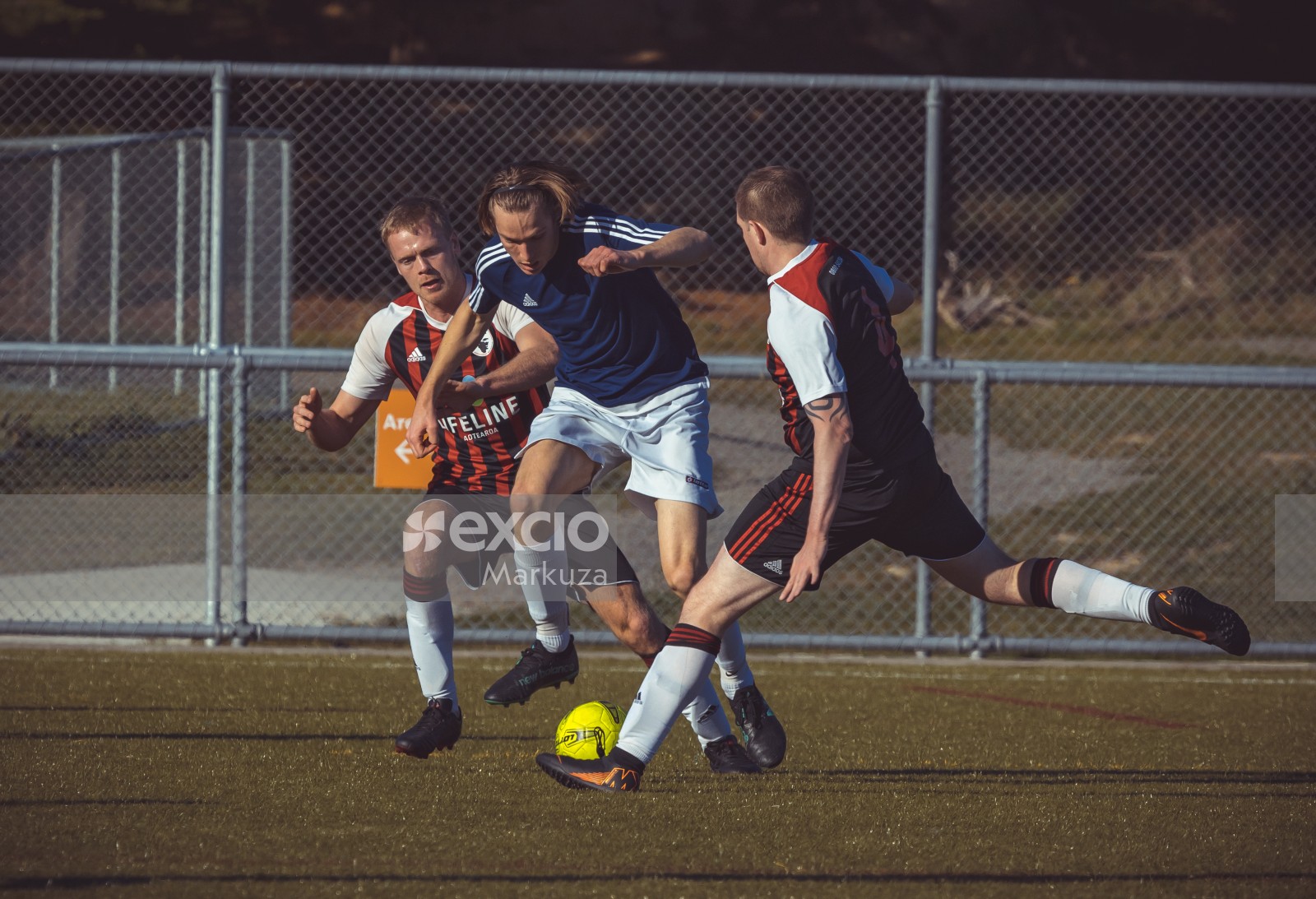 Football player wearing Nike hairband try to steer clear of a tackle - Sports Zone sunday league