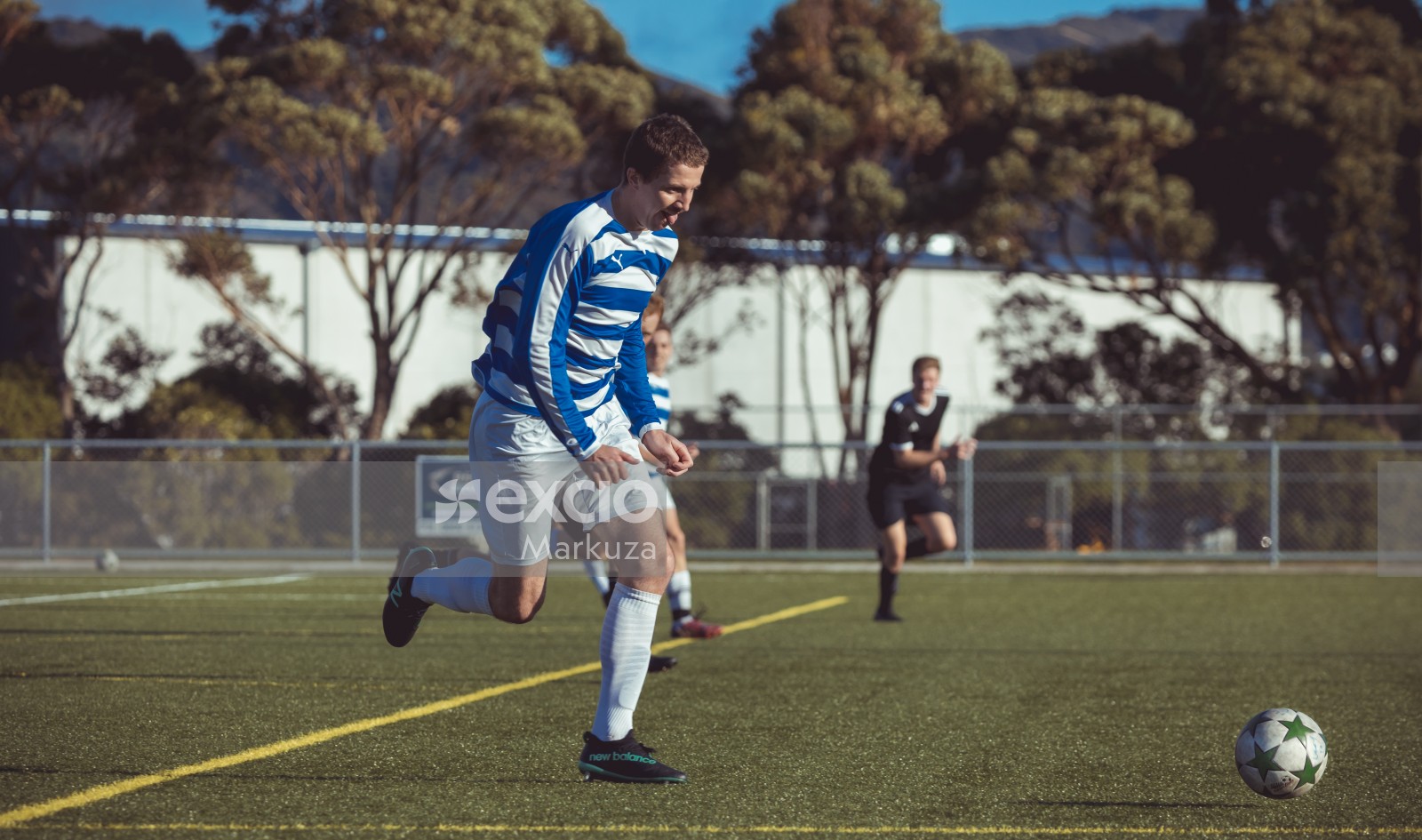 Player sticking out tongue running - Sports Zone sunday league