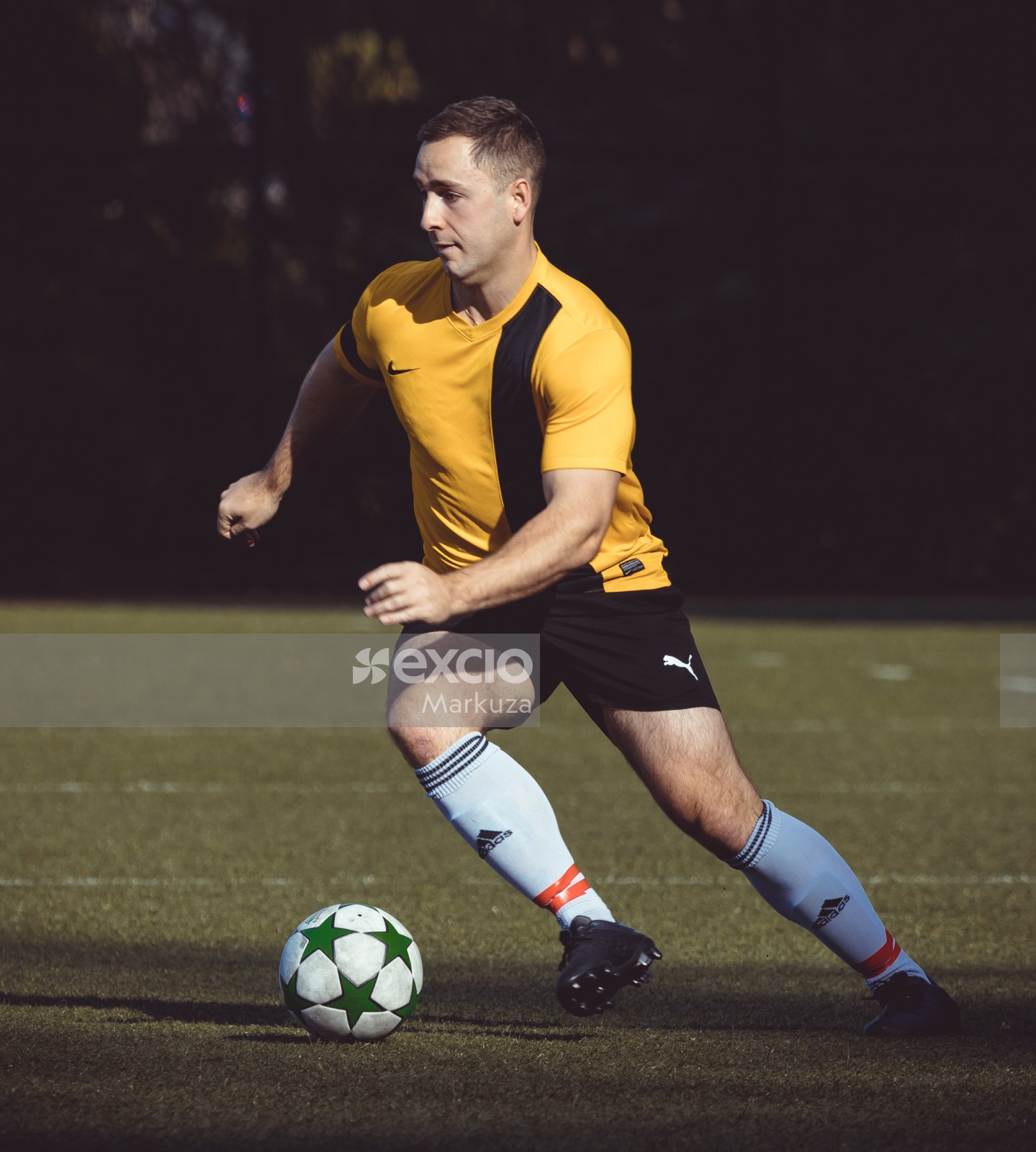 Football player dashing with the ball - Sports Zone sunday league