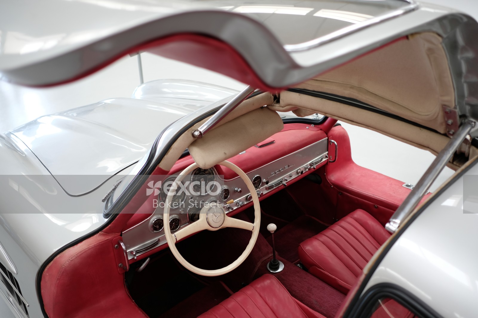 Classic silver Mercedes 300sl gullwing red interior