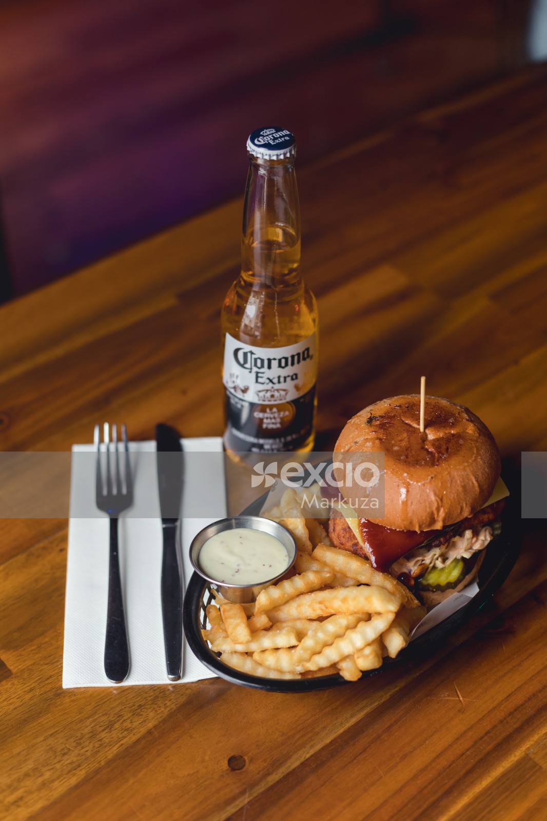 Corona beer, burger and zigzag cut fries
