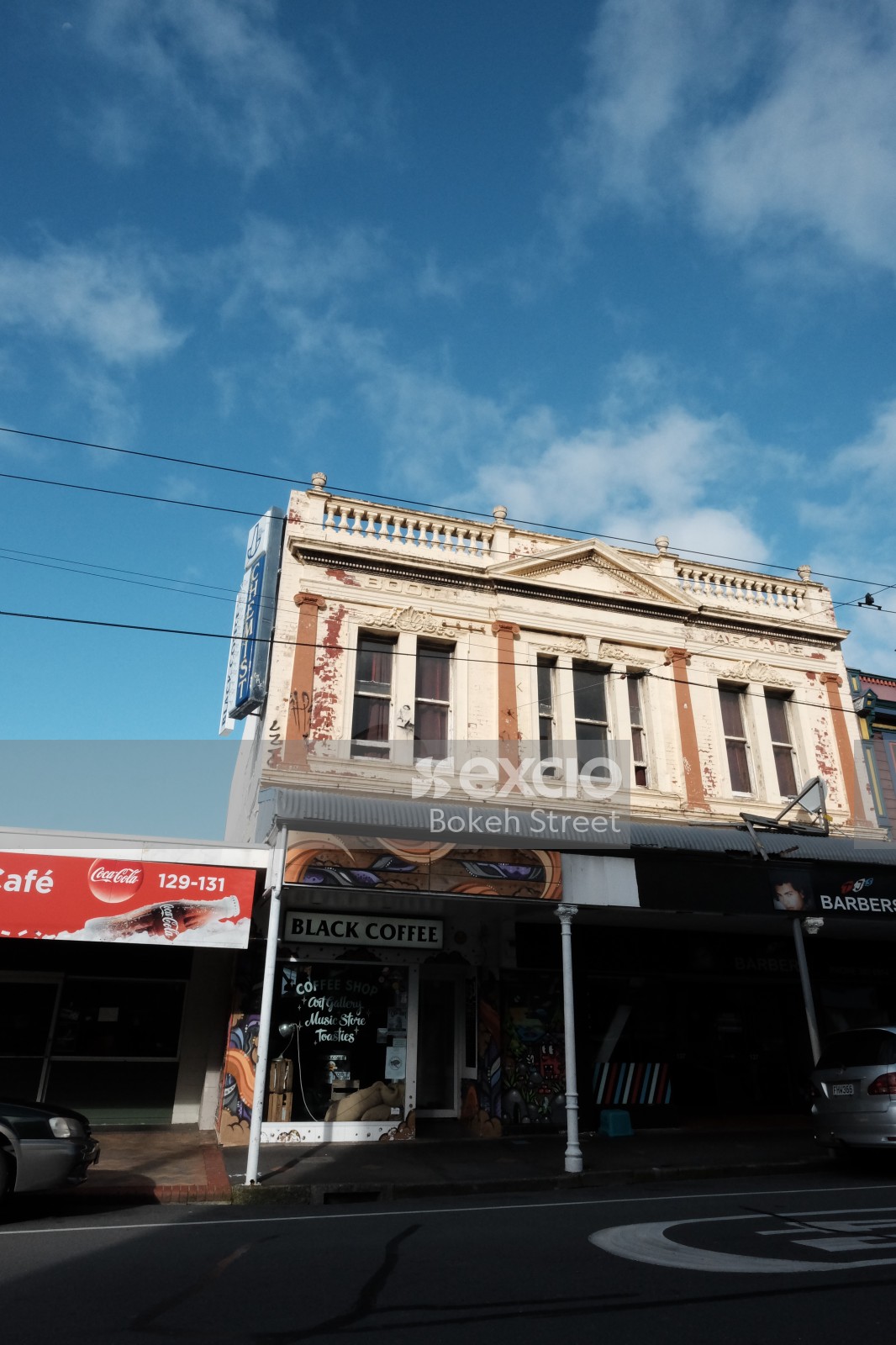 Greek style facade coffee and barber shop in Te Aro