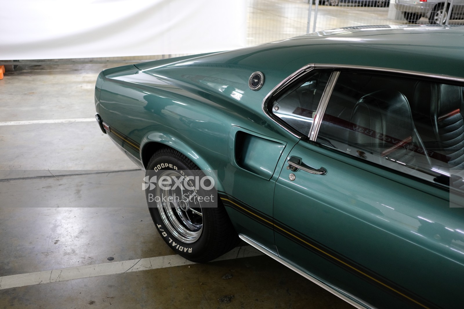Classic teal Ford Mustang Mach 1 rear fender and wheel