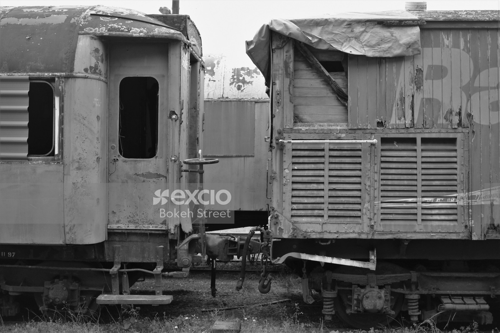 Abandoned old train bogie on track monochrome