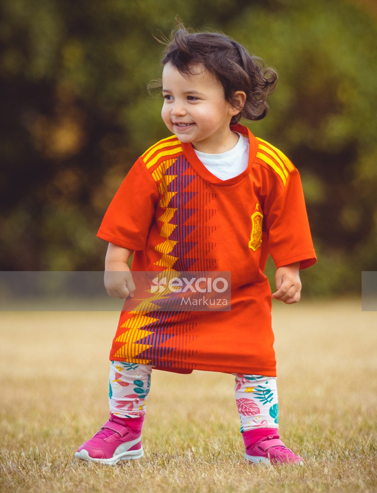 Little girl in a long Manchester United shirt - Little Dribblers