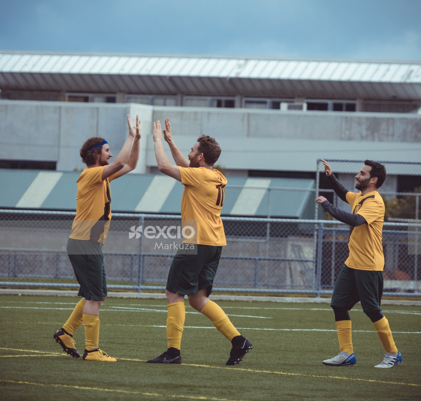 Players double high fiving - Sports Zone sunday league
