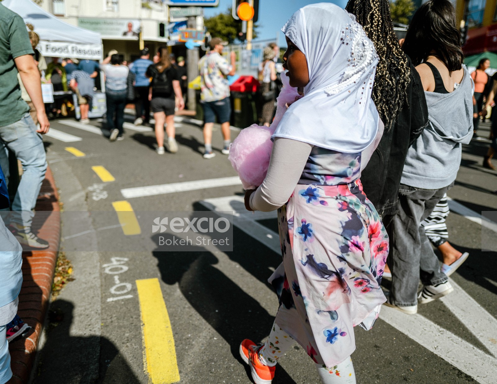 Hijabi little girl with cotton candy at Newtown festival 2021