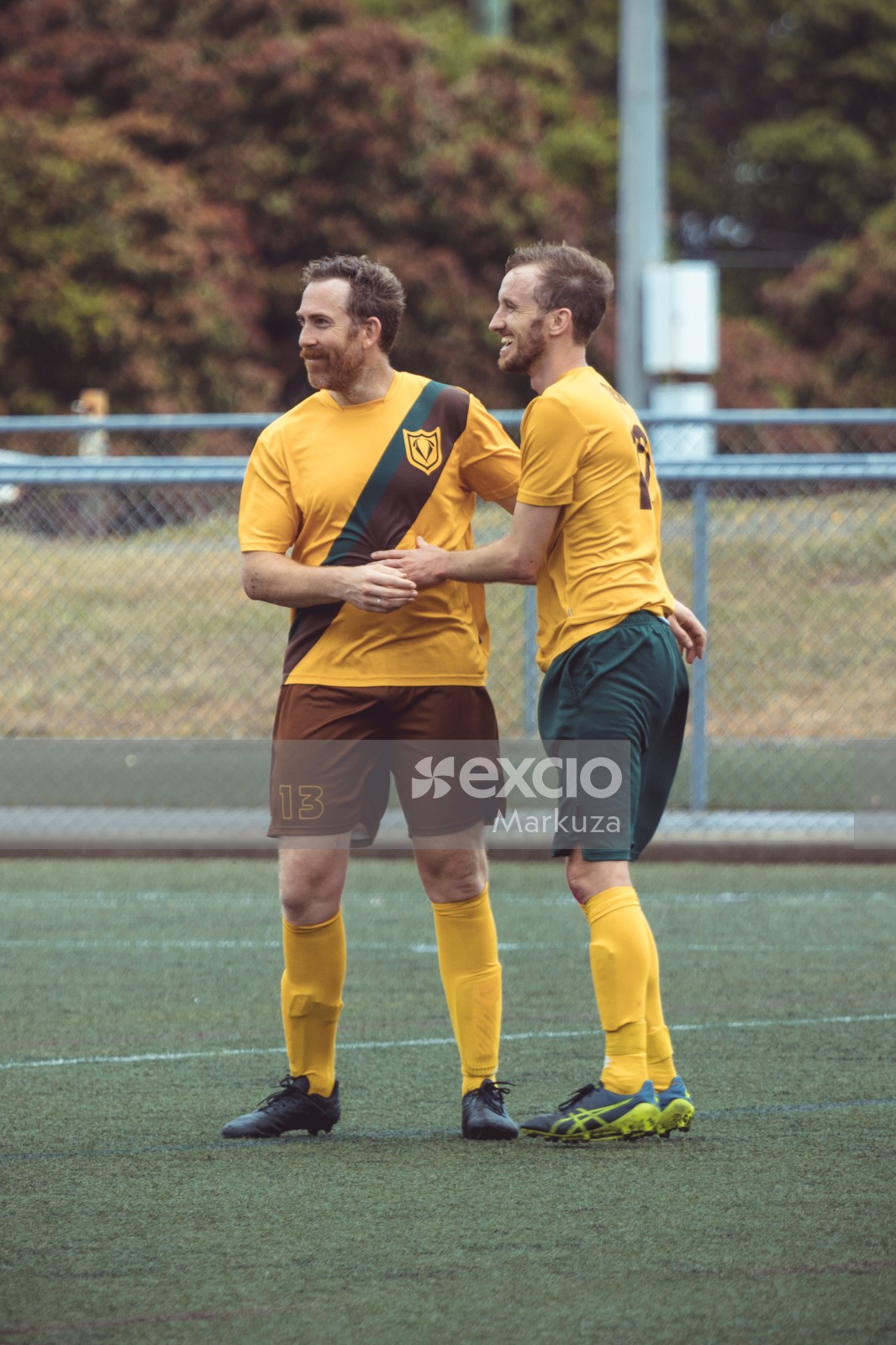 Two teammates smiling during celebration - Sports Zone sunday league