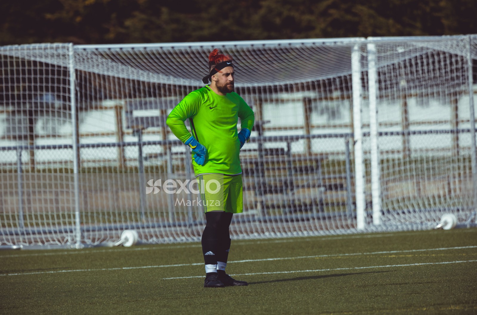 Goalkeeper with red hair and parrot green Nike shirt - Sports Zone sunday league