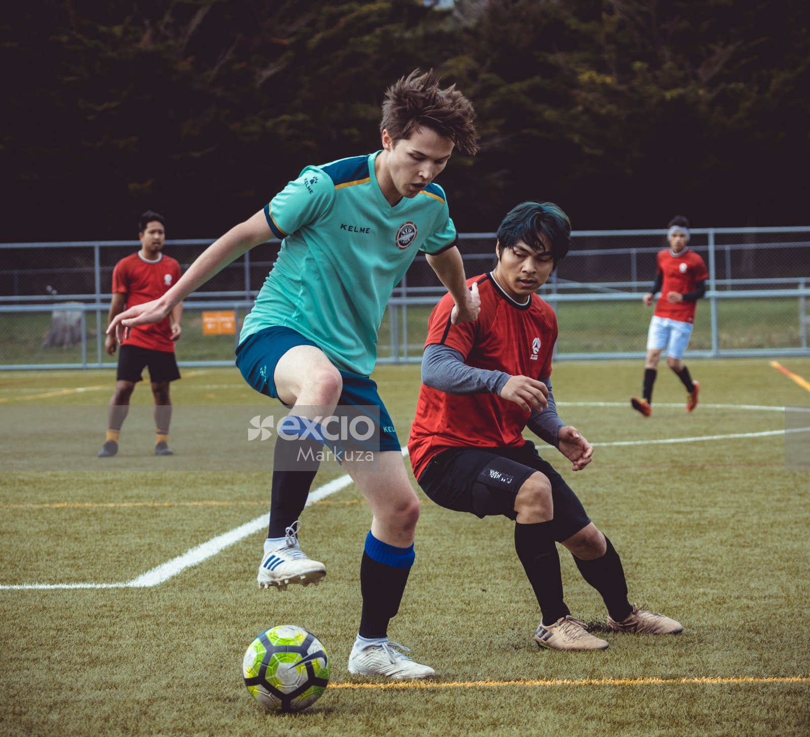 Player in turquoise Kelme shirt stomping on football - Sports Zone sunday league