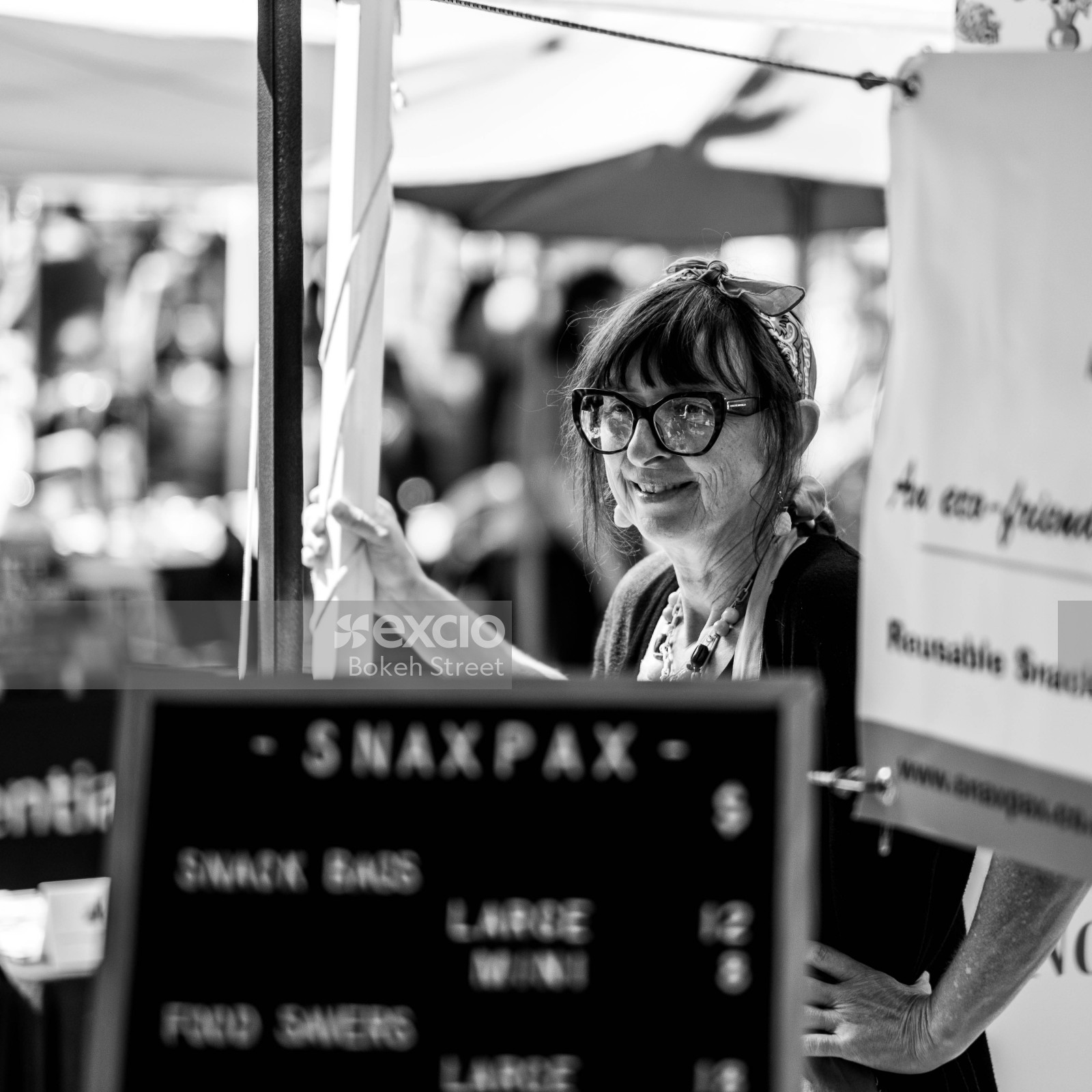 Woman at a food shop in Aro valley Fair 2021 black and white