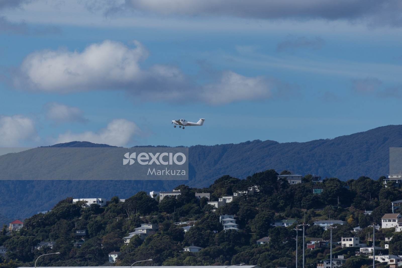 Small aircraft taking off over the city of Wellington