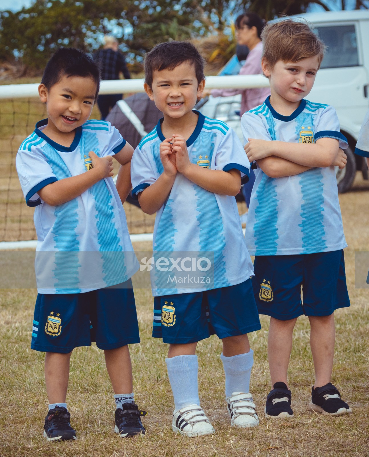 Three boys posing in Argentine kits - Little Dribblers
