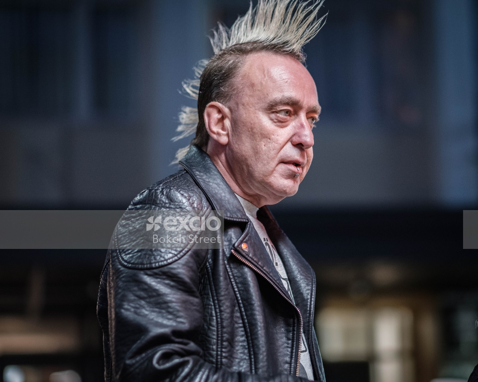 Guy with leather jacket piercing and spiked hairstyle