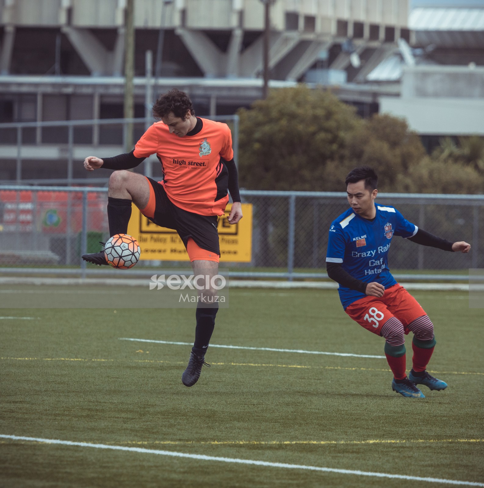 Player in orange shirt reigns football midair - Sports Zone sunday league