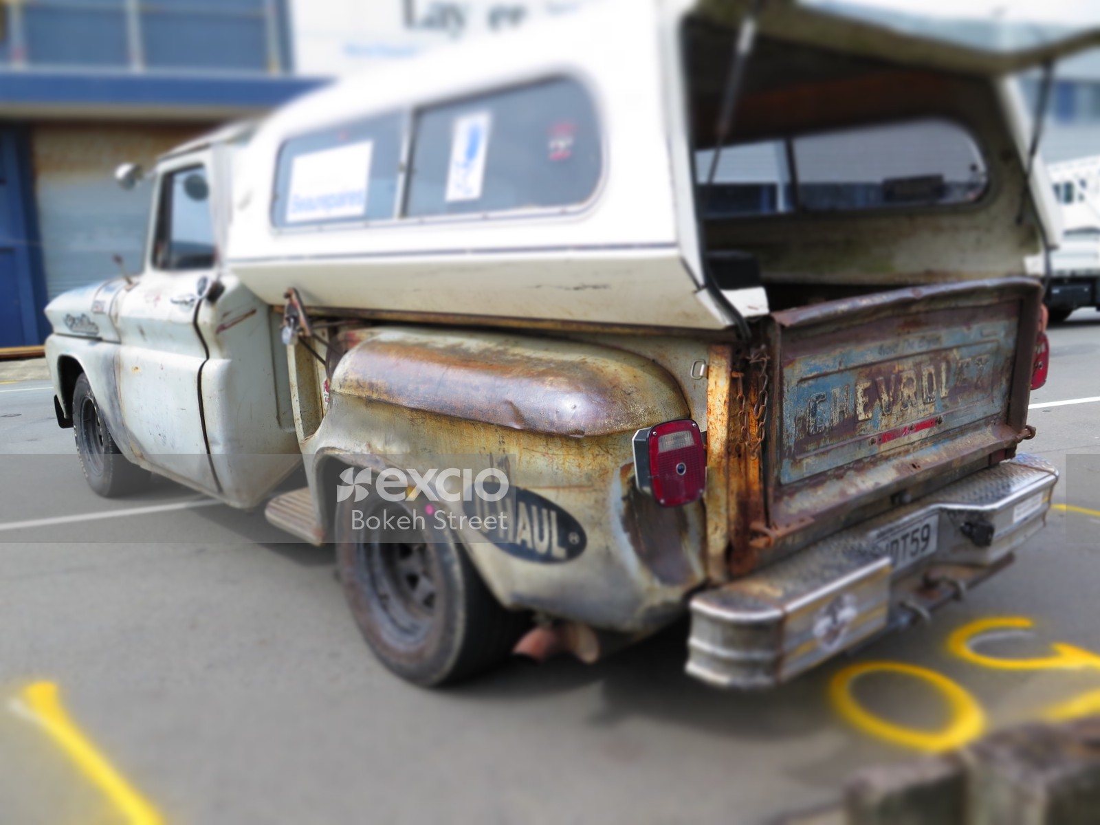 Chevrolet pickup truck with canopy on bed at Port Road drag racing event