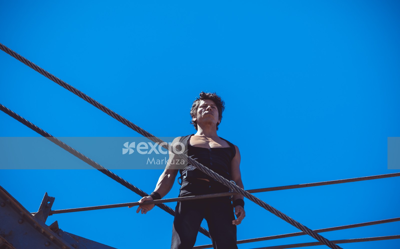 Male performer on a big crane