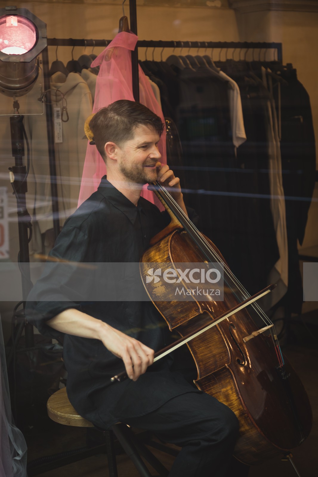 Man playing cello in black attire