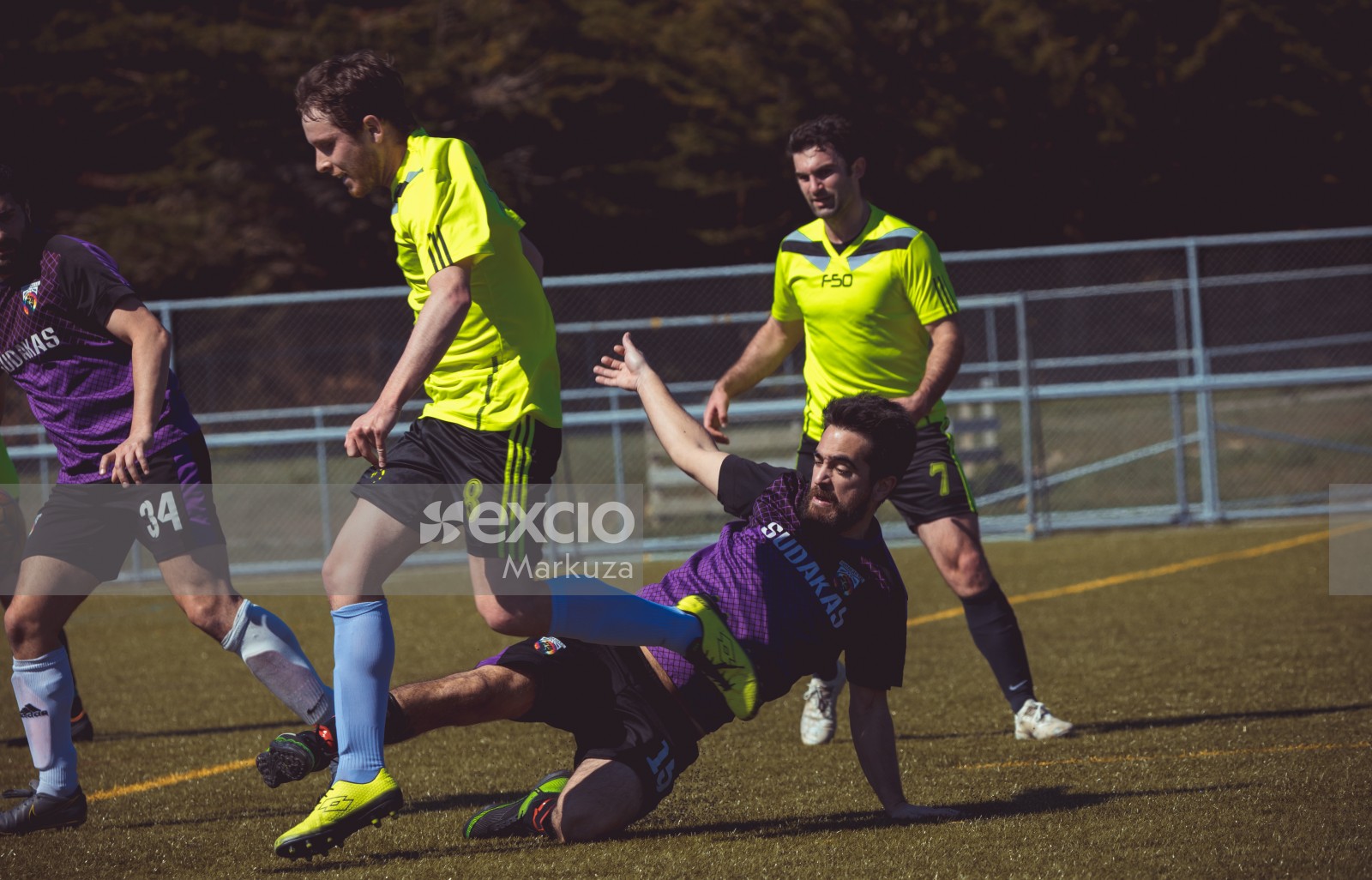 Player No. 15 in purple shirt slide tackle opponent - Sports Zone sunday league