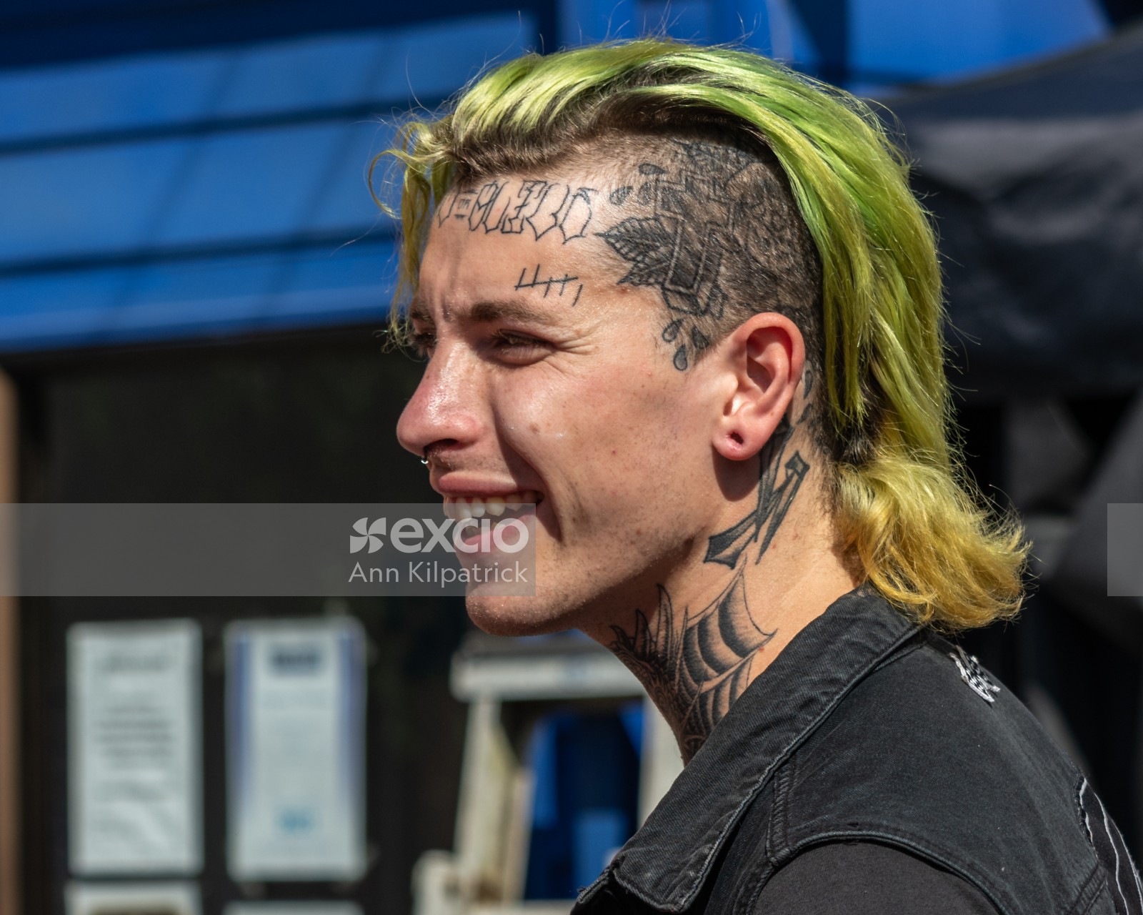 Young man tattoos and yellow hair