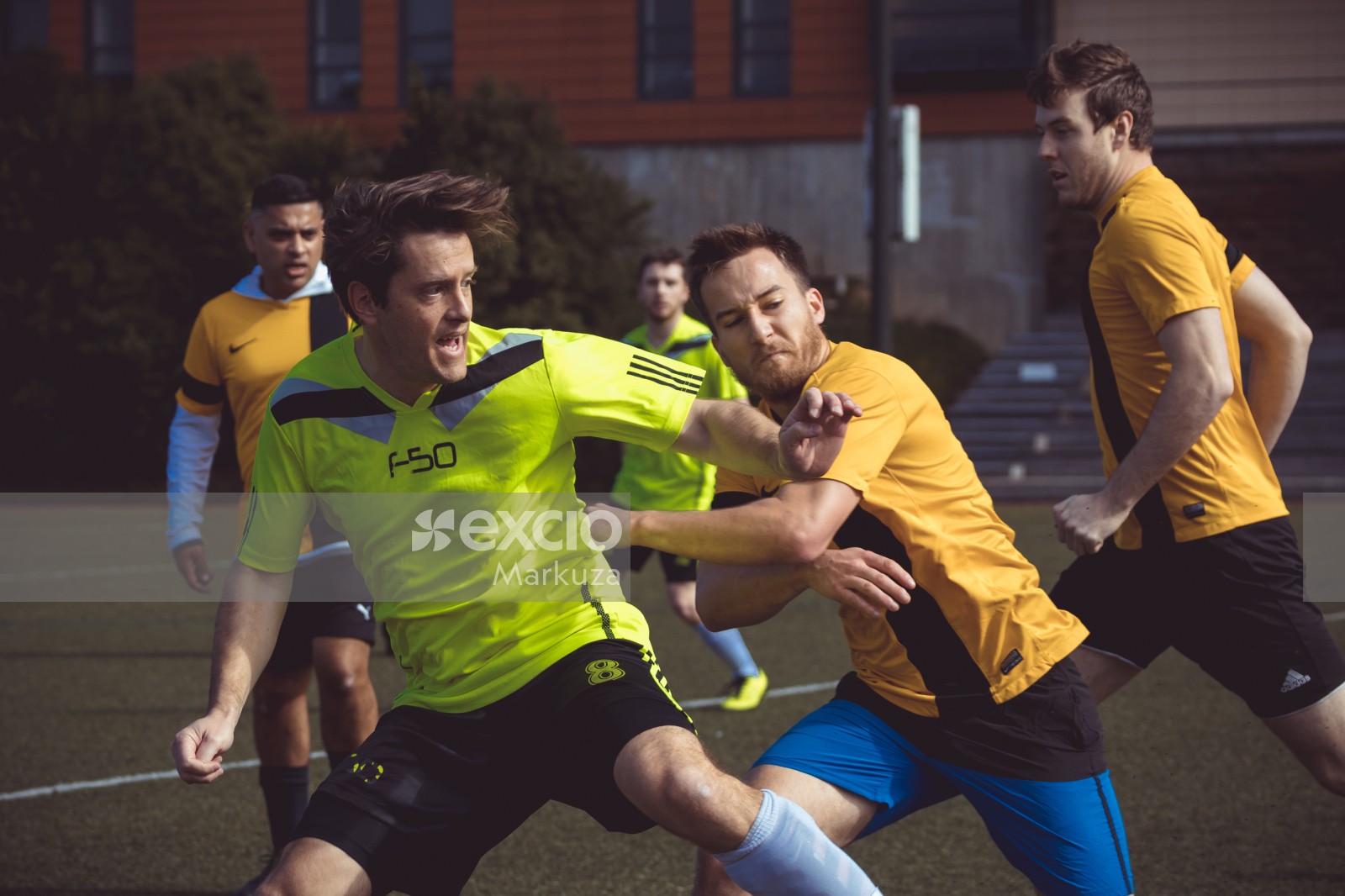 Two football players pushing eachother away - Sports Zone sunday league