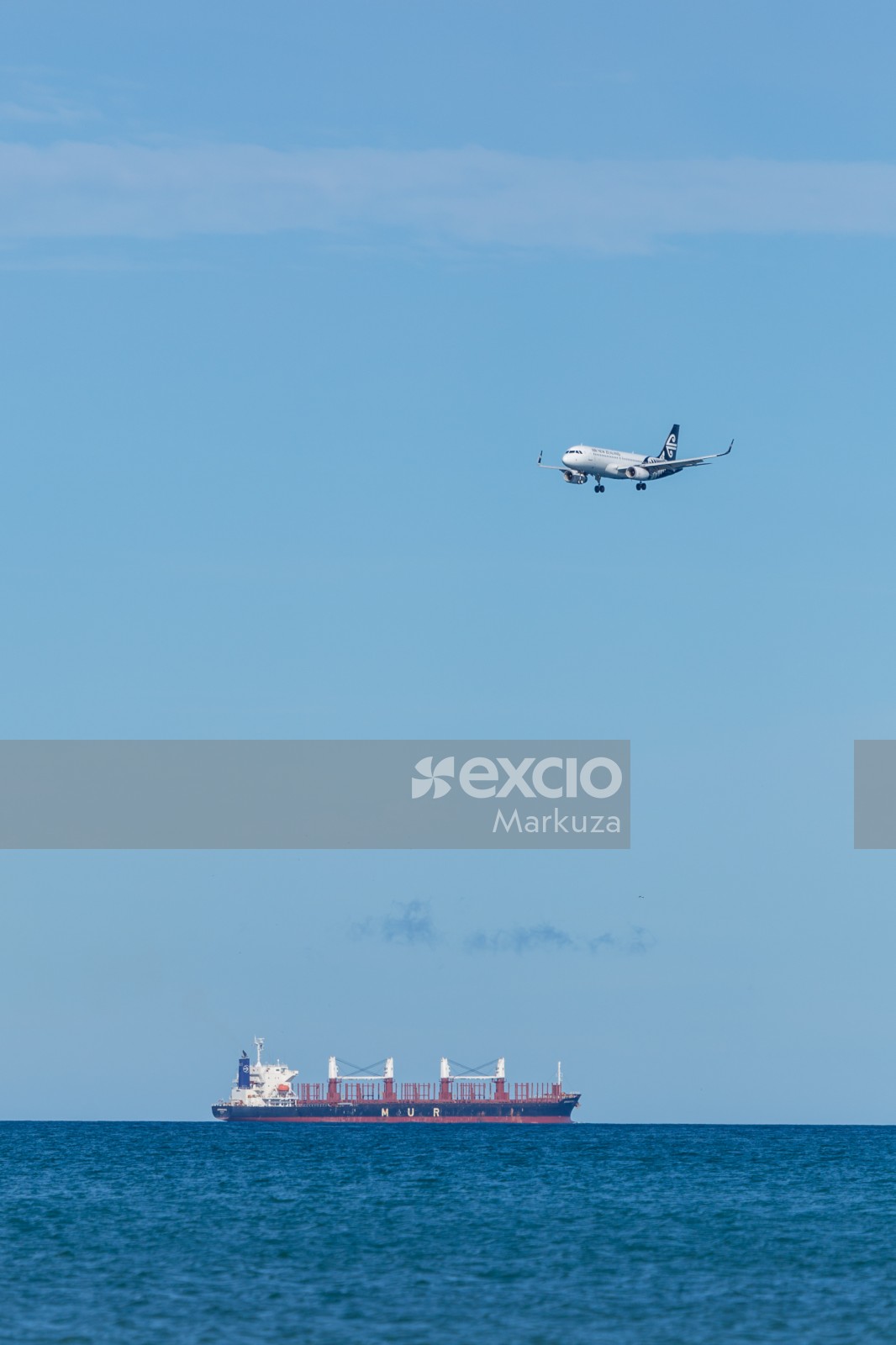 MUR cargo ship and AIR NZ plane over water