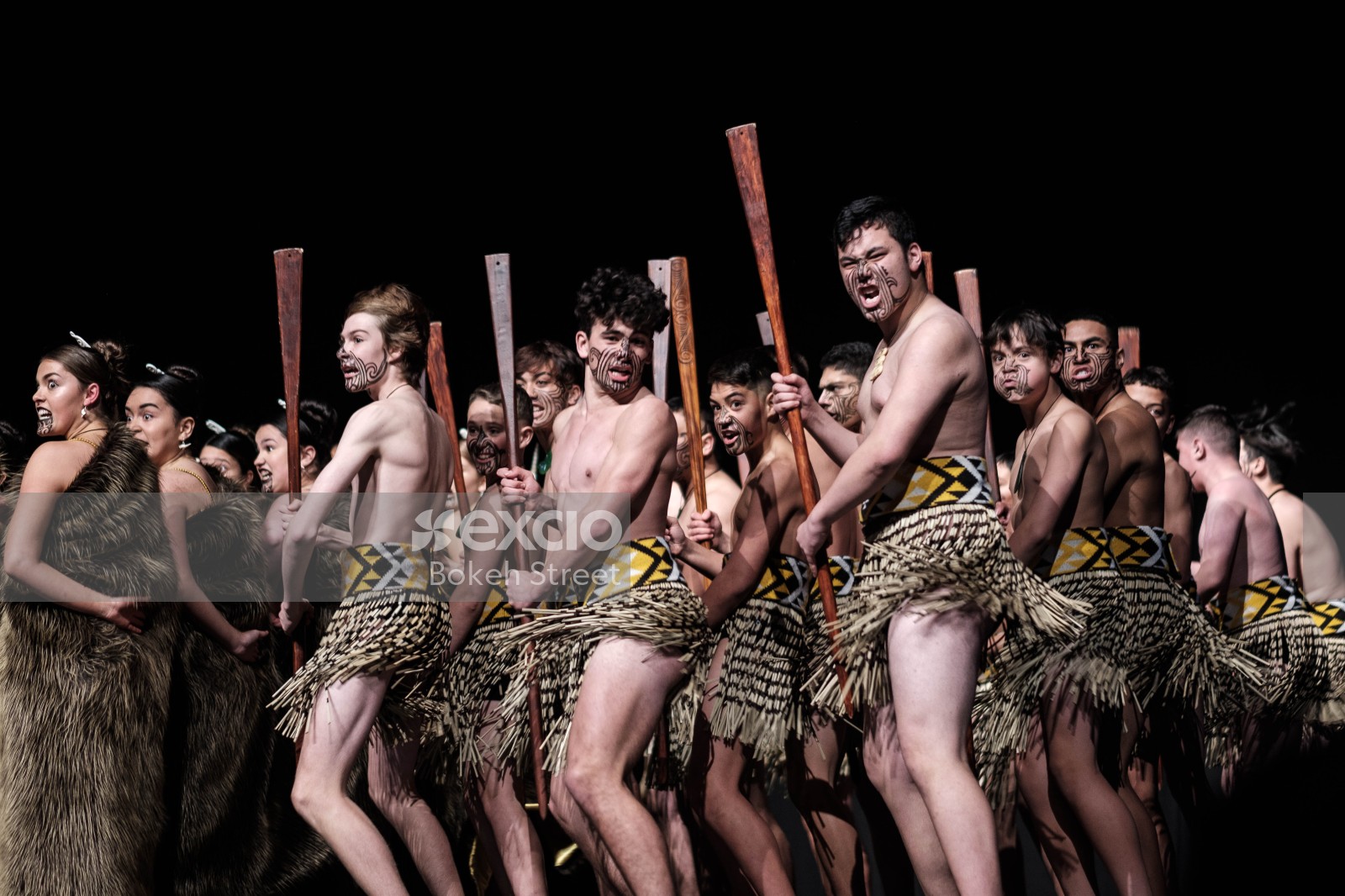 Male Kapa Haka performers with clubs