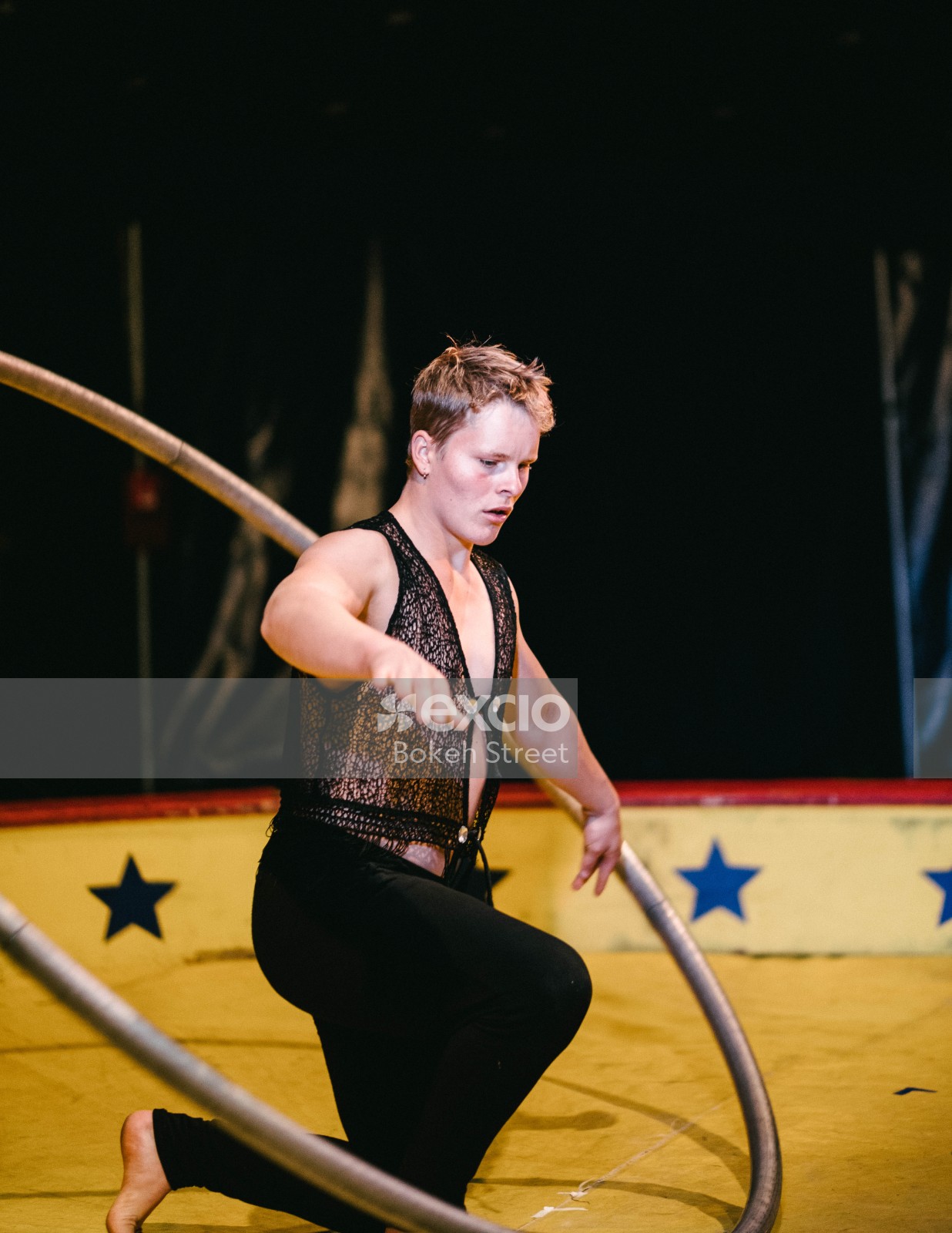Acrobat at a circus performing with ring