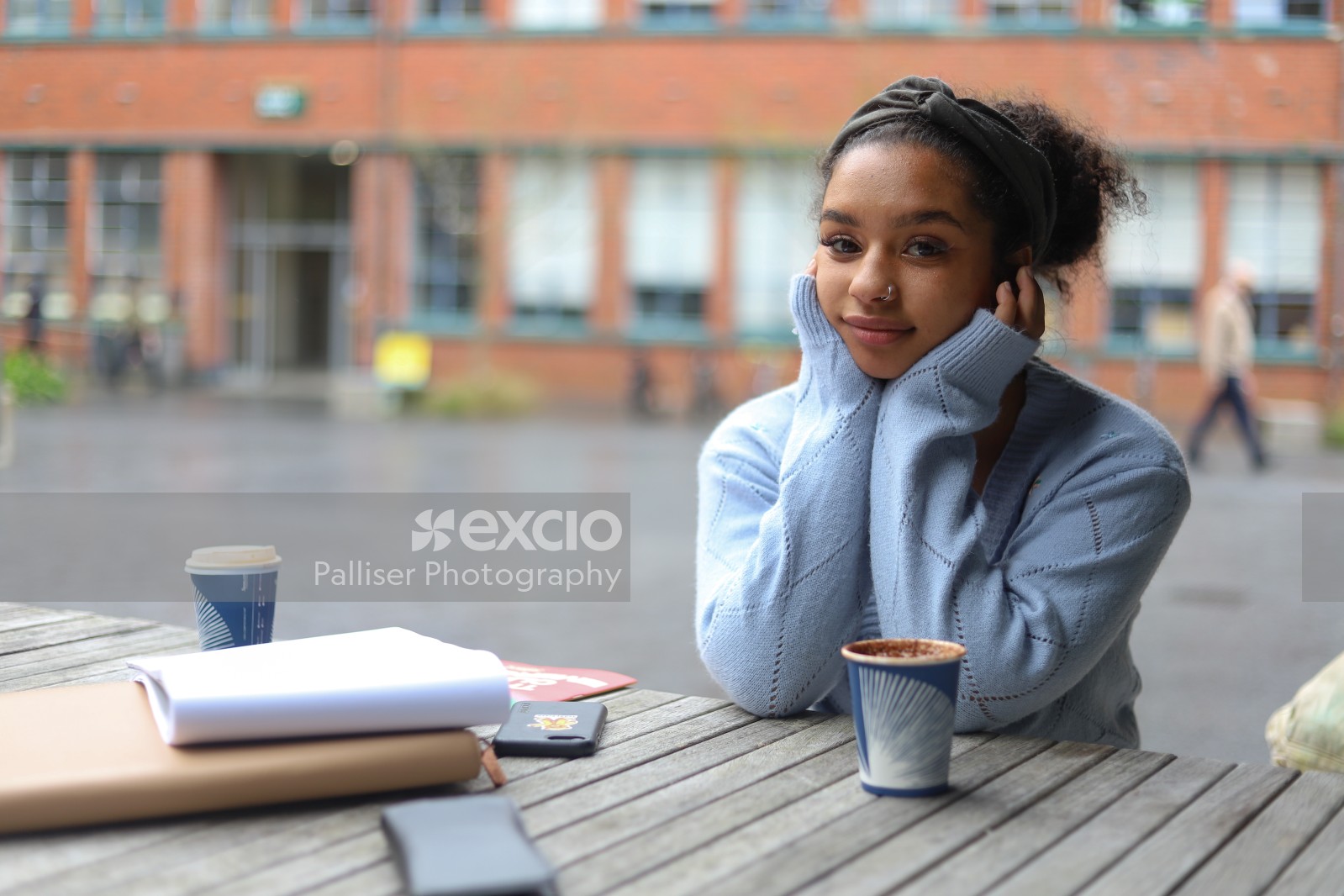 Girl studying with a cup of coffee bokeh