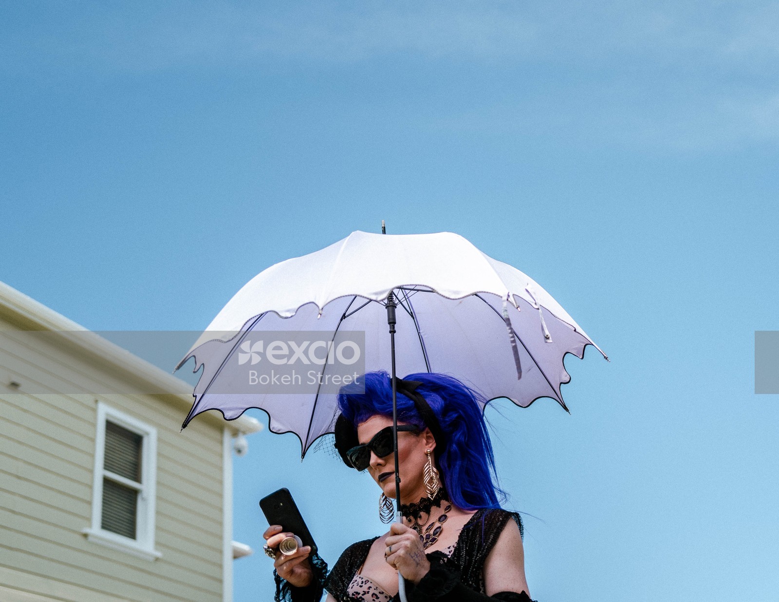 Woman with blue hair and white umbrella at Newtown Festival 2020