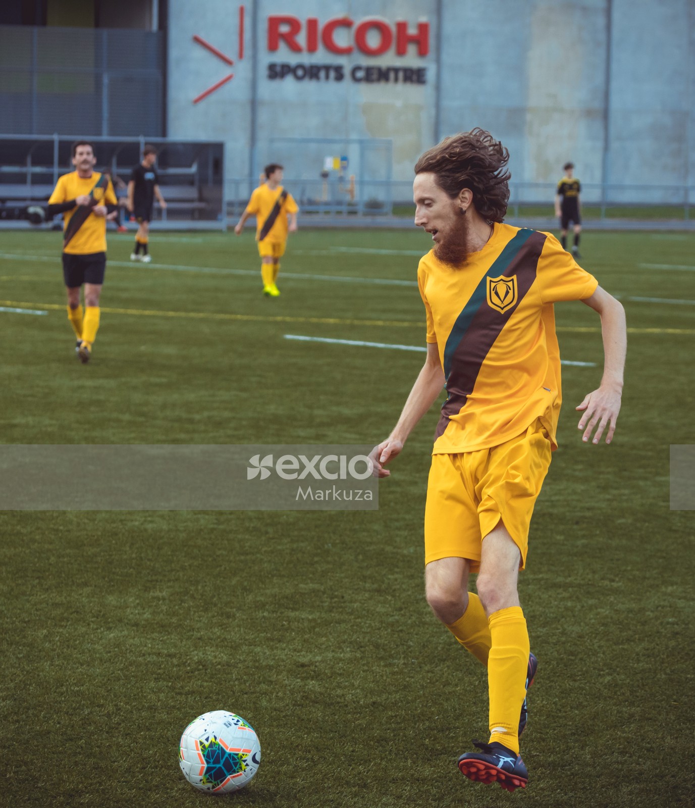 Football player with long hair and earrings - Sports Zone sunday league