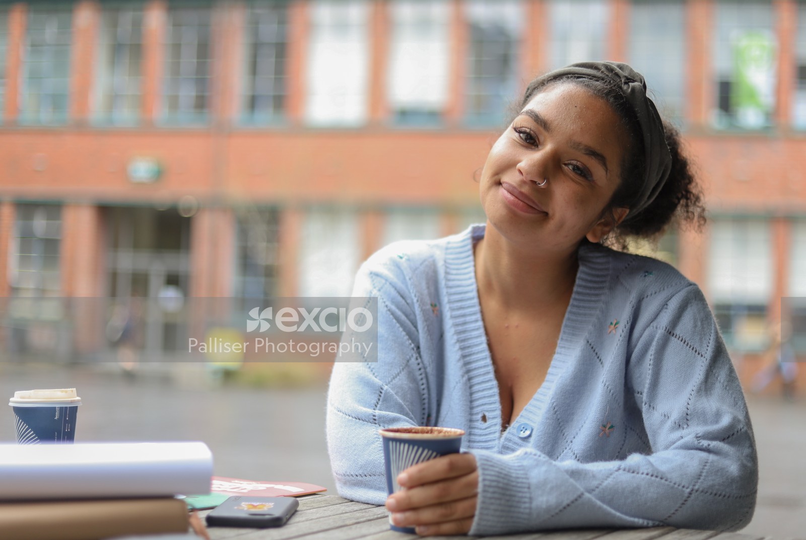 Smiling young lady with coffee