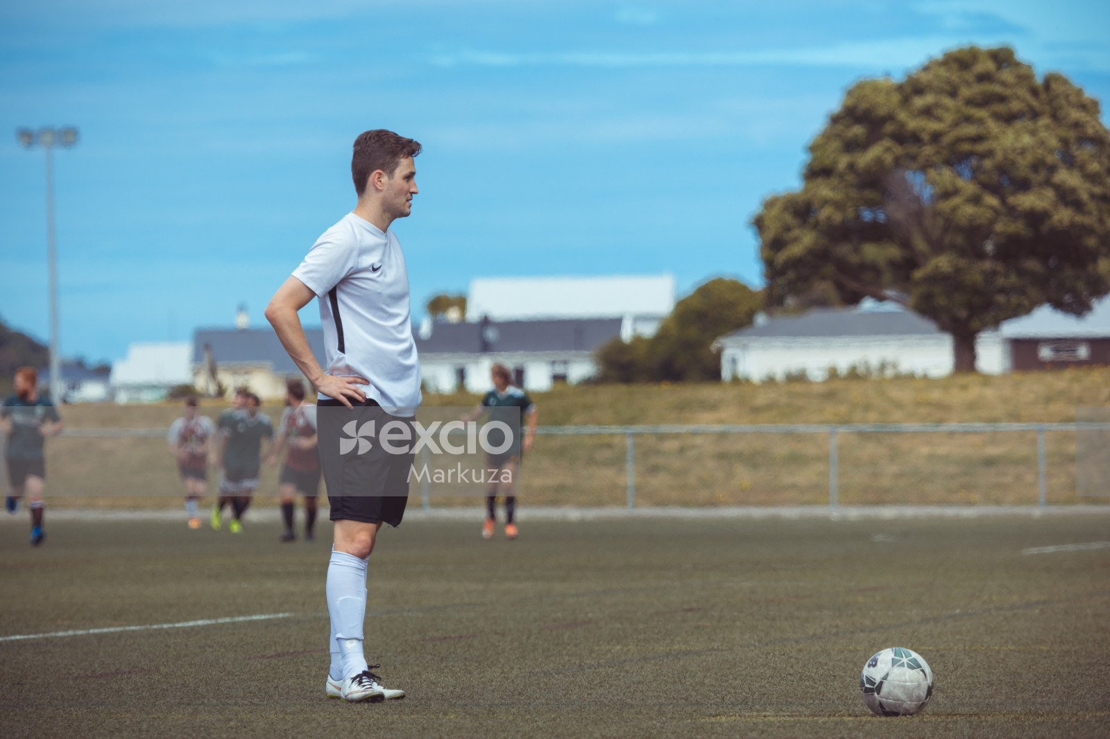 Player in white Nike shirt waiting to kick football - Sports Zone sunday league