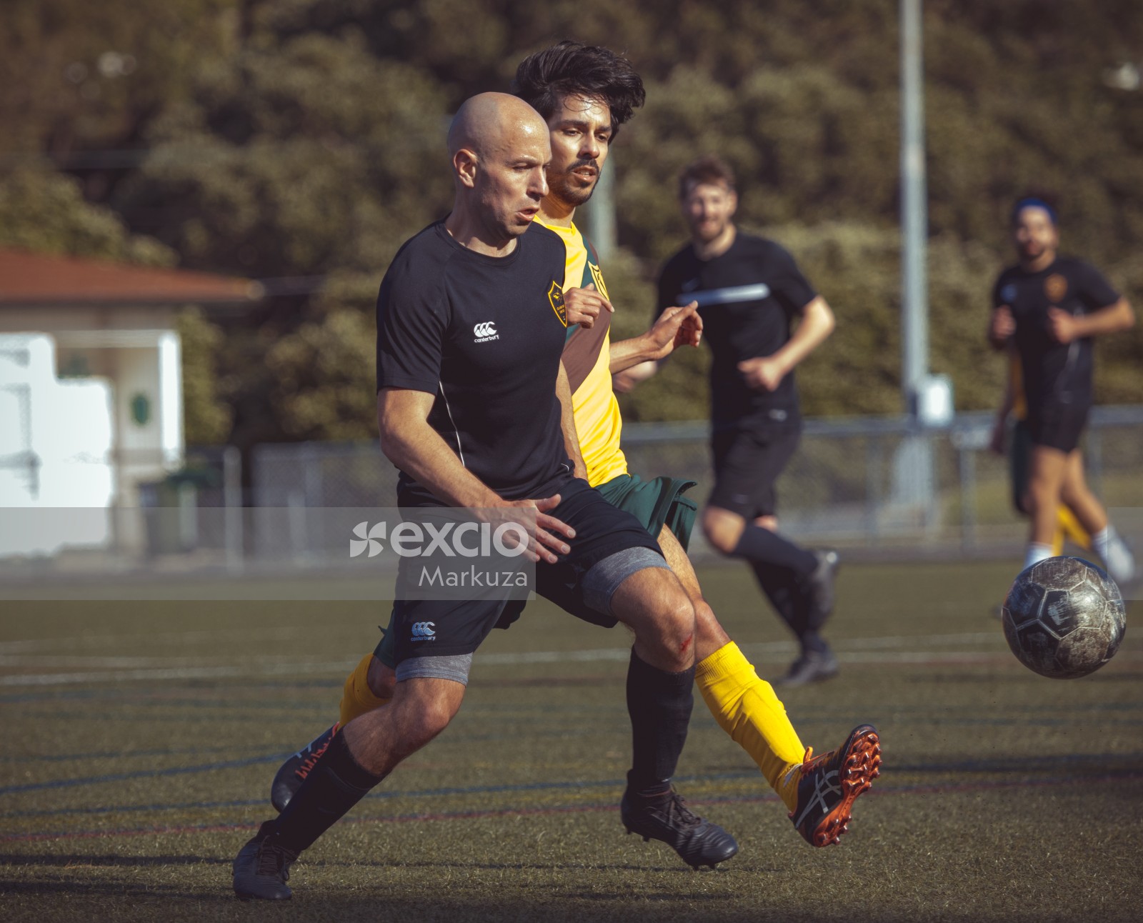 Bald football player with a cut on his knee - Sports Zone sunday league