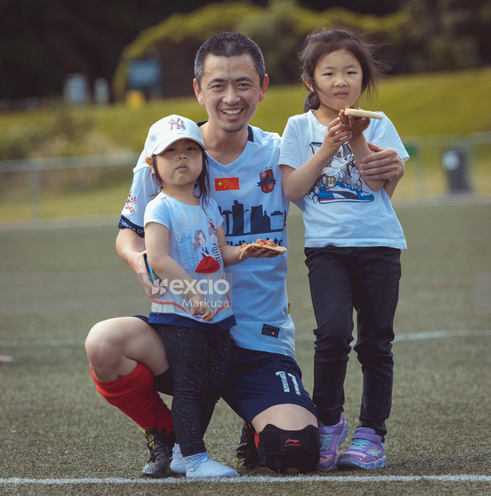 Football player and his two daughters eating pizza - Sports Zone sunday league