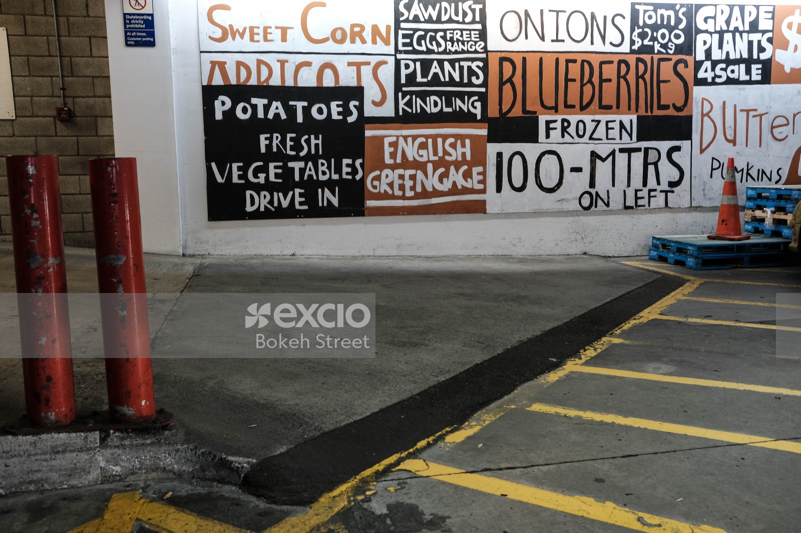 Produce banner advertised on a wall caution cone
