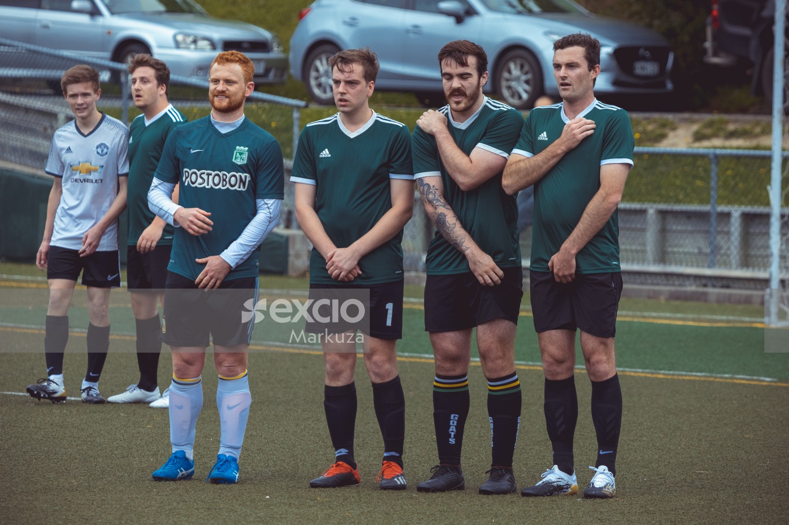 Players in green Adidas shirts form a defence line - Sports Zone sunday league