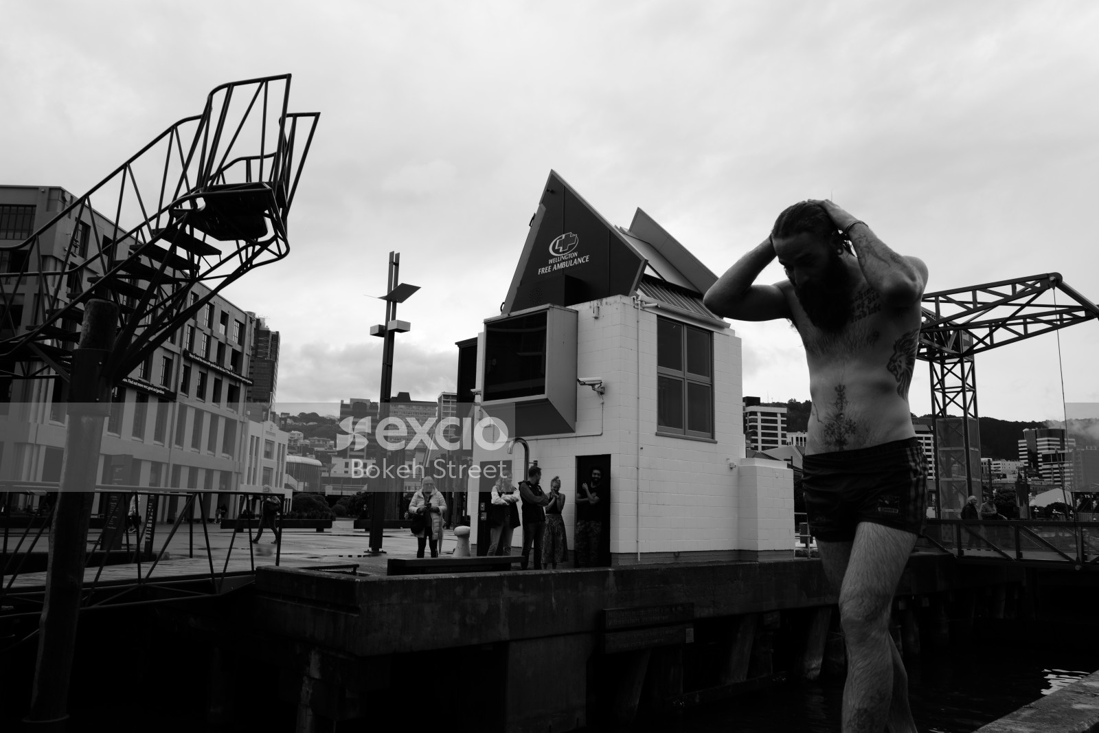 Tattooed man on the wharf black and white